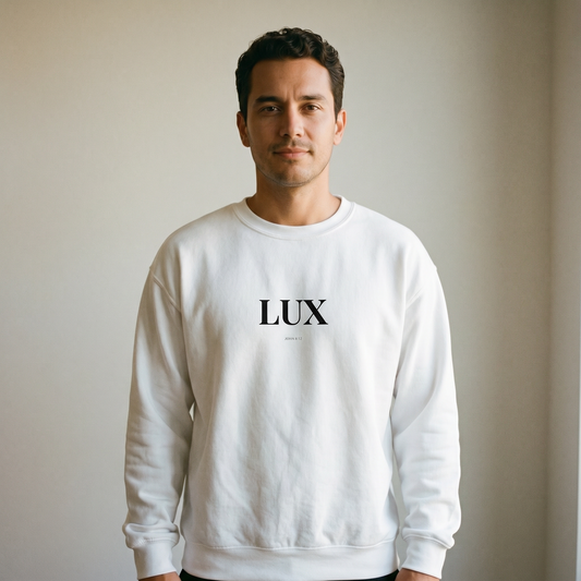 Man wearing a white sweatshirt with 'LUX' printed on it against a plain background
