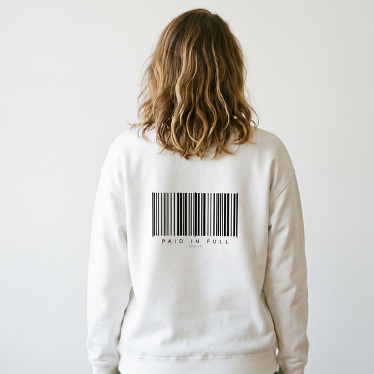 Person wearing a white sweatshirt with a barcode design on the back against a plain background